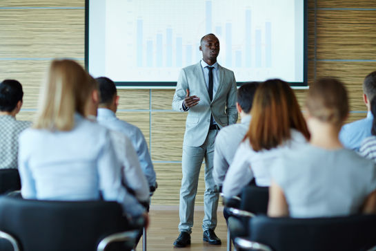 Young teacher presenting new project to managers